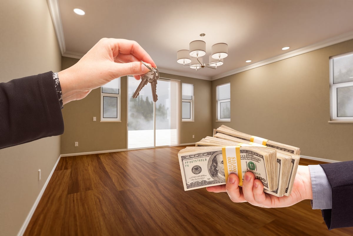 Handing over house keys to a homeowner in a freshly remodeled Polk County home